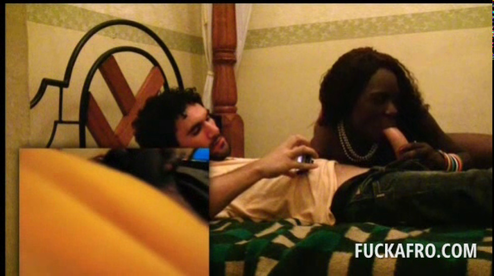 African temptress giving oral sex to a white tourist