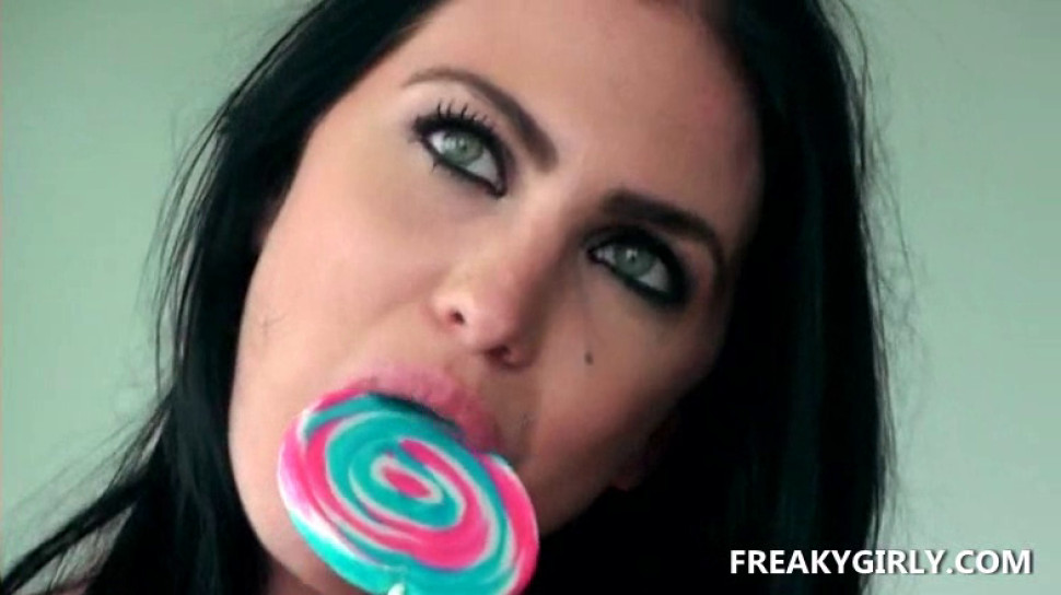 Busty sex queen teasing her pussy with a lollipop