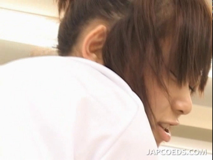 Shy Japanese girl in college giving footjob in classroo