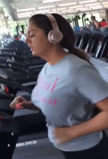Busty gym brunette