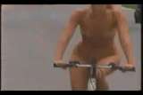 Sandy topless public bikeing